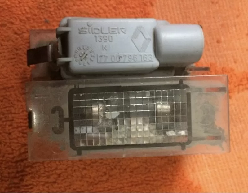 Бу фонарь подсветки номерного знака Renault 7700796163 Laguna 2,  Megane 2,  Master 2
